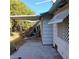 Side view of home with covered area, showing yard debris at 2612 Cabot St, Las Vegas, NV 89102
