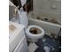 Bathroom with a damaged tub, toilet, and missing tiles, reflecting the need for renovation at 2612 Cabot St, Las Vegas, NV 89102
