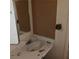 Damaged bathroom vanity with missing pieces, dirty sink and mirror at 2612 Cabot St, Las Vegas, NV 89102