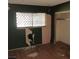 Bedroom with damaged walls, missing drywall, and remnants of wallpaper, showing need for extensive repair at 2612 Cabot St, Las Vegas, NV 89102