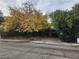 Street view of home with mature landscaping and fall foliage at 2612 Cabot St, Las Vegas, NV 89102