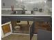 Damaged kitchen cabinet with water damage at 2612 Cabot St, Las Vegas, NV 89102