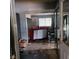 Living room showing a vintage sofa, dirty floors and debris at 2612 Cabot St, Las Vegas, NV 89102