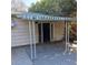 Back of house with small covered patio area and white support beams at 2612 Cabot St, Las Vegas, NV 89102