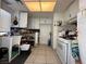 Kitchen with white cabinets, stove, and a large sink at 2793 Artic St, Las Vegas, NV 89121