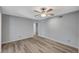 Simple bedroom with hardwood floors and ceiling fan at 3152 S Eastern Ave # 26, Las Vegas, NV 89169