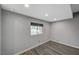 Simple bedroom with gray walls, wood-look floors, and a window at 3152 S Eastern Ave # 26, Las Vegas, NV 89169