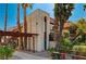 Spanish style condo building with palm trees and walkway at 3152 S Eastern Ave # 26, Las Vegas, NV 89169