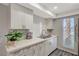Updated kitchen with white shaker cabinets and stainless steel appliances at 3152 S Eastern Ave # 26, Las Vegas, NV 89169
