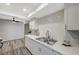 White kitchen with subway tile backsplash and stainless steel sink at 3152 S Eastern Ave # 26, Las Vegas, NV 89169