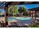 Community pool with a relaxing atmosphere and pergola at 3152 S Eastern Ave # 26, Las Vegas, NV 89169