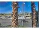 View of the street from a window, showing palm trees and cityscape at 3152 S Eastern Ave # 26, Las Vegas, NV 89169
