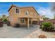 Spacious backyard with covered patio, desert landscaping and block wall at 3349 Morning Amber St, North Las Vegas, NV 89032