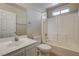 This bright bathroom features a tub shower, tile flooring and a vanity sink at 3349 Morning Amber St, North Las Vegas, NV 89032