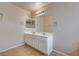 Bathroom featuring double sinks, large mirror and neutral paint at 3349 Morning Amber St, North Las Vegas, NV 89032