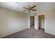Bedroom featuring neutral walls, carpet, ceiling fan and views into the hallway and closet at 3349 Morning Amber St, North Las Vegas, NV 89032