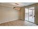 Dining area with modern lighting, tile flooring, and sliding door to back patio at 3349 Morning Amber St, North Las Vegas, NV 89032