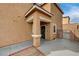 Home's entrance with a security door and tan stucco exterior at 3349 Morning Amber St, North Las Vegas, NV 89032