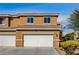 Two-story home with a two-car garage and desert landscaping at 3349 Morning Amber St, North Las Vegas, NV 89032