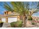 Two-story home with a three-car garage and well-maintained landscaping for enhanced curb appeal at 3349 Morning Amber St, North Las Vegas, NV 89032