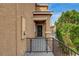 Exterior view showcasing the home's front entry with a secure gate and well-maintained landscaping at 3349 Morning Amber St, North Las Vegas, NV 89032