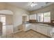 Open kitchen with white cabinetry, connecting seamlessly to the outdoor living space and backyard at 3349 Morning Amber St, North Las Vegas, NV 89032