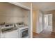 Convenient laundry closet with white washer and dryer units at 3349 Morning Amber St, North Las Vegas, NV 89032