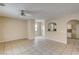 Open living room with tile flooring and a ceiling fan offering a cozy gathering space at 3349 Morning Amber St, North Las Vegas, NV 89032