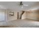 Open living space with tile flooring, arched doorways, and a staircase leading to the upper level at 3349 Morning Amber St, North Las Vegas, NV 89032