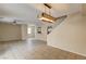Bright and open living area showcasing tile floors, stylish lighting, and a comfortable layout at 3349 Morning Amber St, North Las Vegas, NV 89032