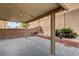 The covered patio features string lights and a landscaped yard for outdoor living and relaxation at 3349 Morning Amber St, North Las Vegas, NV 89032