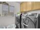 Laundry room with washer, dryer, and cabinets at 3537 Cherico St, Las Vegas, NV 89129