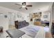 Bright living room featuring tile floors, comfy couches, and a ceiling fan at 3537 Cherico St, Las Vegas, NV 89129