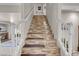 Interior view of a staircase with tile flooring and white railings at 3537 Cherico St, Las Vegas, NV 89129