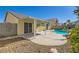 Landscaped backyard has a pool, covered patio, and privacy walls at 3709 Ferrell St, North Las Vegas, NV 89032