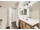 Bathroom features a modern vanity, a large mirror and a shower-tub combo at 3709 Ferrell St, North Las Vegas, NV 89032