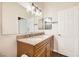 Modern bathroom features a double vanity, granite countertops and framed mirror at 3709 Ferrell St, North Las Vegas, NV 89032