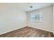 A well-lit bedroom features wood-look floors and modern shuttered windows at 3709 Ferrell St, North Las Vegas, NV 89032
