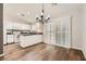 Dining room featuring hard wood floors and bright windows with modern lighting at 3709 Ferrell St, North Las Vegas, NV 89032