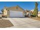 Single-story house with a two-car garage and basketball hoop at 3709 Ferrell St, North Las Vegas, NV 89032