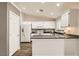 Well lit kitchen features white cabinets, granite countertops and stainless steel appliances at 3709 Ferrell St, North Las Vegas, NV 89032