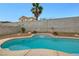 A beautiful pool features a waterfall and mature desert landscaping for privacy at 3709 Ferrell St, North Las Vegas, NV 89032