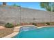 A beautiful pool features mature desert landscaping and a tranquil setting at 3709 Ferrell St, North Las Vegas, NV 89032