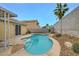 Backyard pool with lush landscaping offers a private retreat at 3709 Ferrell St, North Las Vegas, NV 89032