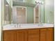 Bathroom with a vanity, double sinks, and a large mirror at 38 E Serene Ave # 134, Las Vegas, NV 89123