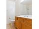 Bathroom with a light wooden vanity, white countertop, and tiled floors at 38 E Serene Ave # 134, Las Vegas, NV 89123