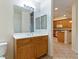 Bathroom featuring a wooden vanity, large mirror, and tiled flooring at 38 E Serene Ave # 134, Las Vegas, NV 89123