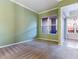Spacious bedroom with green accent wall and neutral carpet flooring at 38 E Serene Ave # 134, Las Vegas, NV 89123