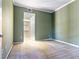 Bedroom with light green walls and a view into a closet at 38 E Serene Ave # 134, Las Vegas, NV 89123
