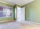 Spacious bedroom featuring neutral carpet, light green walls, and bright natural light at 38 E Serene Ave # 134, Las Vegas, NV 89123